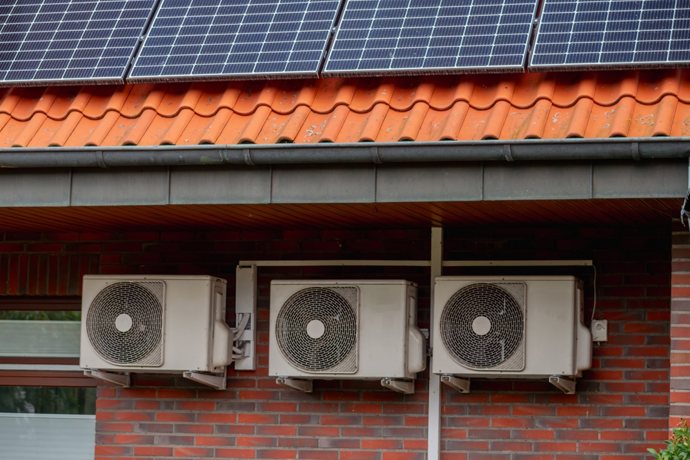 Solar,panels,on,the,roof,and,three,air,conditioner,on